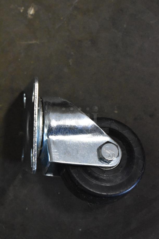 Metal swivel caster with black rubber wheel, bolt marked "4.8", in good condition. Ideal for carts or furniture.