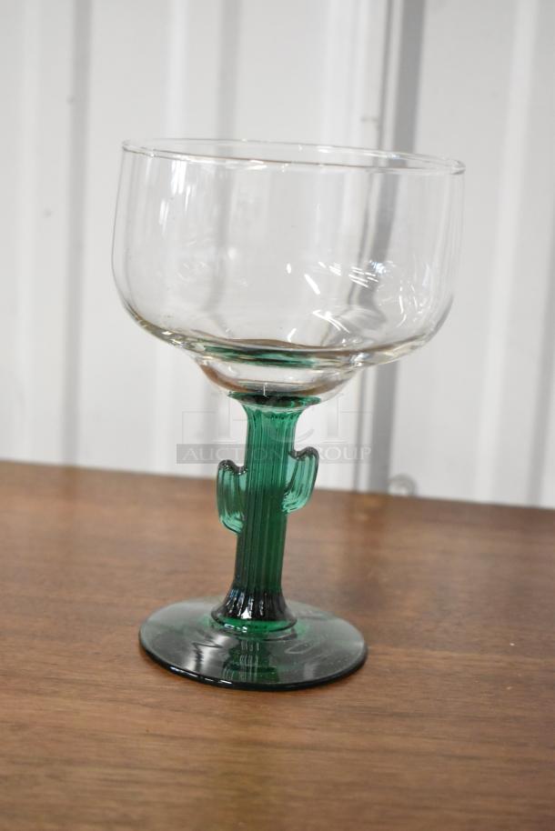 Clear margarita glass with green cactus-shaped stem, excellent condition, suitable for themed collections.