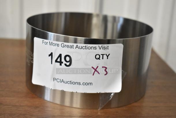 Stainless steel ring mold, auction lot 149, quantity 3, excellent condition, PCI Auctions label visible.