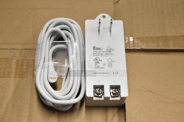 Ktec AC Adaptor Model KSA-11B-075150HU, input 100-240V, output 7.5V, 1.5A, includes coiled white cable, new condition.