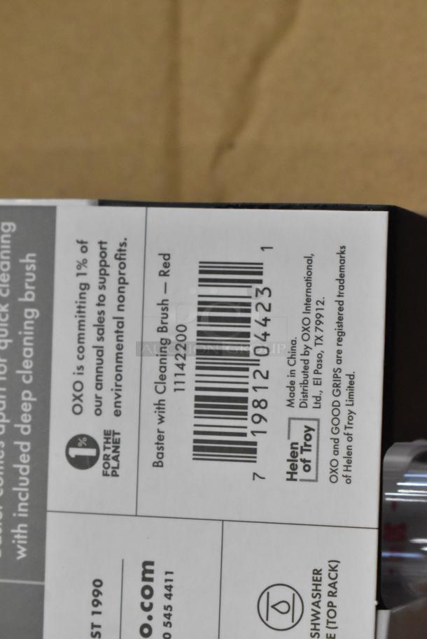 Box side view of OXO Baster with Cleaning Brush. Labels indicate support for environmental nonprofits and dishwasher safety. Made in China.