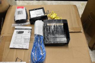 Electronics kit with wiring, labeled controller, manual, and mounting accessories on a cardboard box.