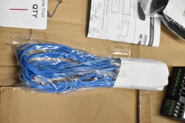 Blue cables in sealed plastic, new condition. Includes instructional pamphlet on cardboard background. Label reads "QTY 1."