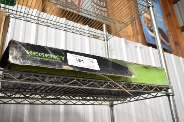 Regency plumbing and hardware boxed item on wire shelf, box slightly worn, auction label 161 from PCI Auctions.