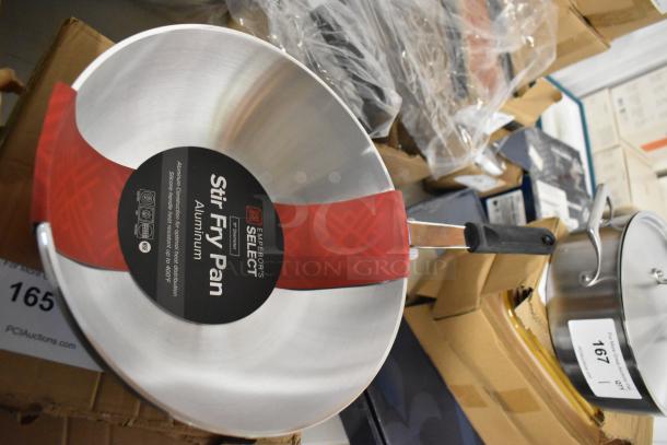 Emperor's Select aluminum stir fry pan, new, with ergonomic handle and heat-resistant label indicating NSF certification.