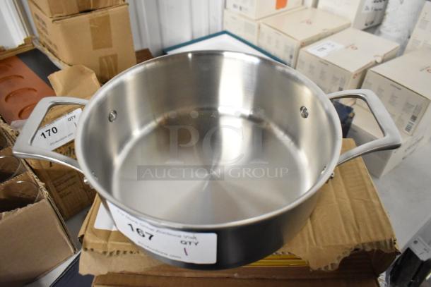 Stainless steel pot with dual handles, auction label "167" visible, excellent condition, ideal for professional cooking.