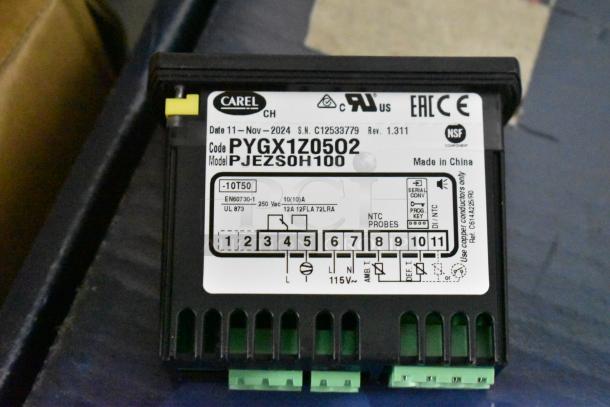 Carel electronic controller, model PJEZSOH100, code PYGX1Z0502. Labels show specs and connectivity info. Made in China.