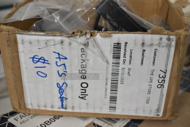 Damaged cardboard box with a label from "THE UPS STORE." Handwritten note in blue ink: "AJ's Seating $10."