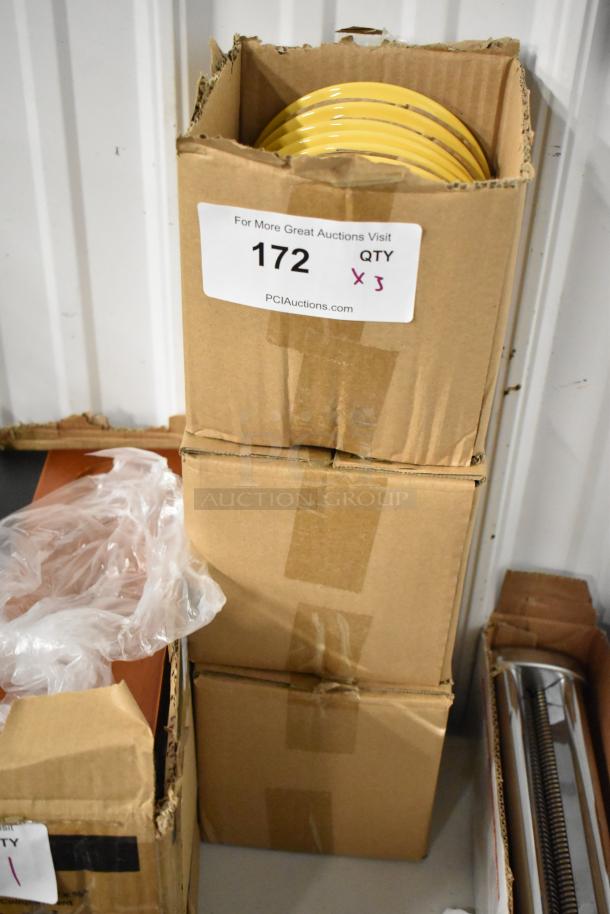 Cardboard box with yellow plates, marked as lot 172, quantity 3, from PCI Auctions. Box shows minor wear.