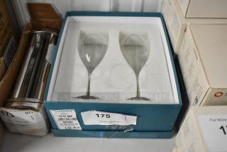 Set of two Christofle Triana crystal wine glasses in original box, condition like new. Label indicates model number 79 62 002.