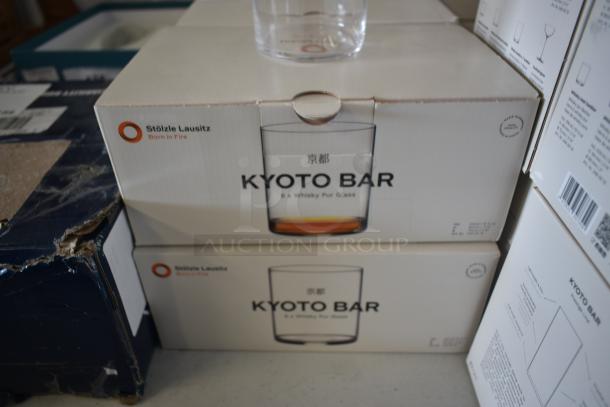 Boxes of Stölzle Lausitz Kyoto Bar whiskey glasses. Packaging marked "Born in Fire," six glasses per box, new condition.