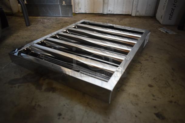 Stainless steel louvered vent in excellent condition, featuring multiple horizontal slats for airflow.