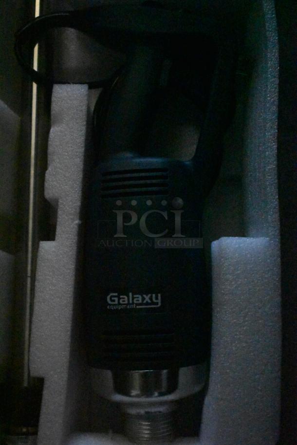 Galaxy immersion blender, black, in foam packaging. Branding label marked "Galaxy equipment." Excellent condition.