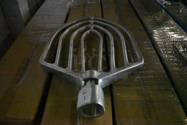 Metal rake head, silver, unused condition, large tines for efficient raking. Label reads “QTY: 1”.