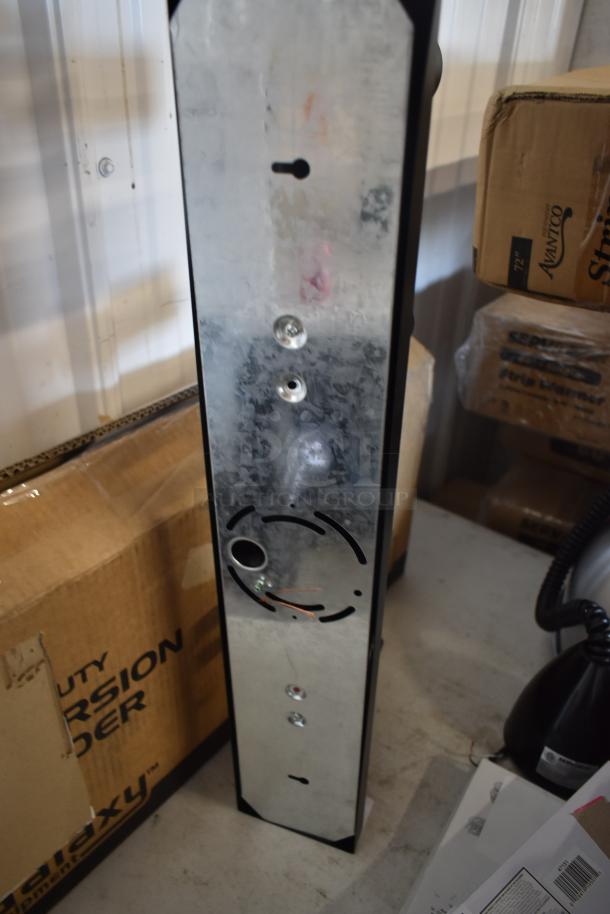 Metal panel with mounting holes and wire entry, new condition. Nearby packaging reads "Avamco Striker" and "Galaxy."