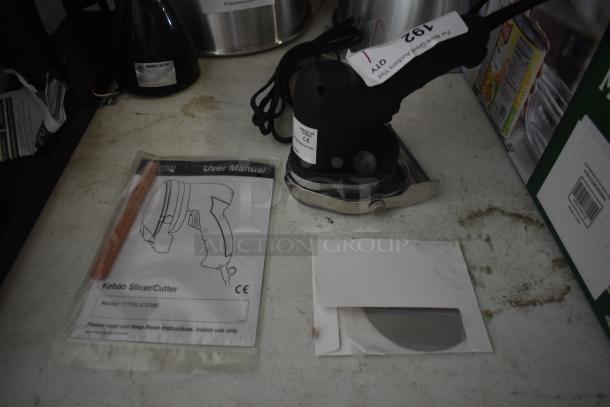 Electric kebab slicer with user manual and replacement blade, model 177KSLICER80. Slightly used condition.