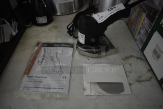 Electric kebab slicer with user manual and replacement blade, model 177KSLICER80. Slightly used condition.