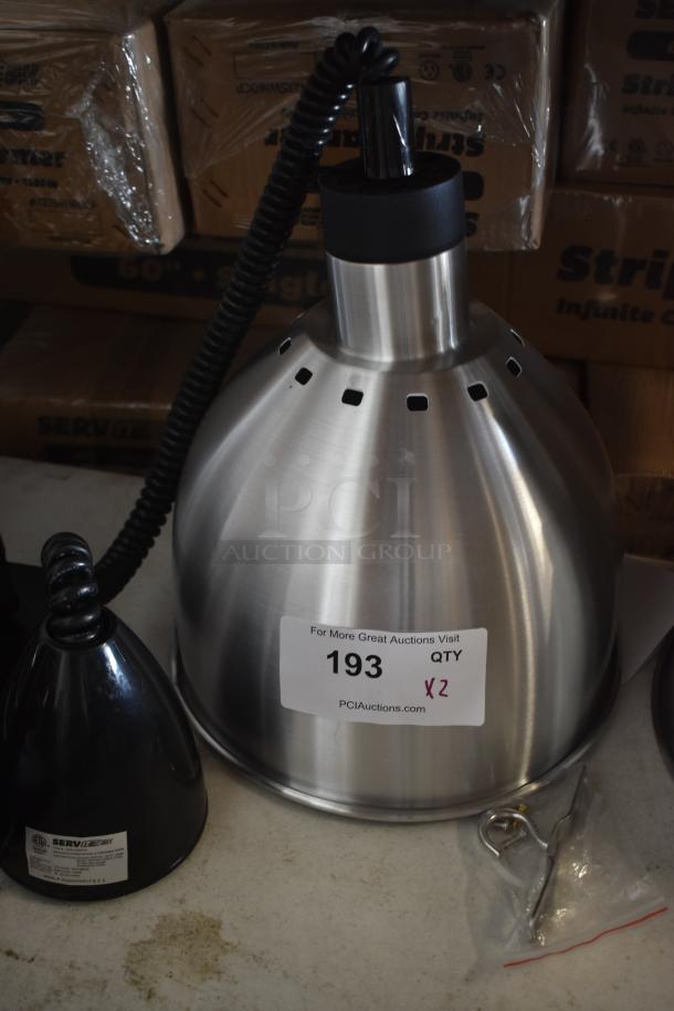 Stainless steel heat lamp with coiled cord, model label, and auction tag indicating quantity of 2. Includes mounting hardware.
