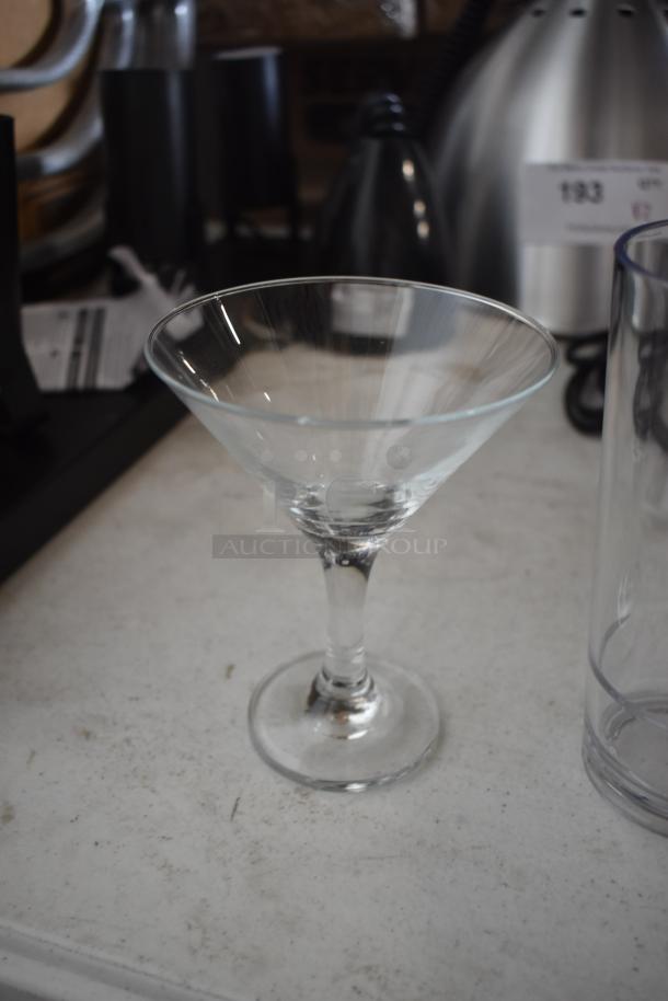 Clear martini glass, 8 oz capacity, classic design, excellent condition, ideal for cocktails and bar collections.