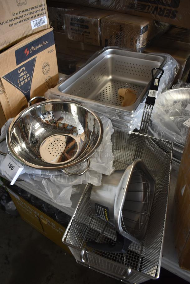 Assorted stainless steel kitchen utensils, including colander and perforated pans, in new condition with visible labels.