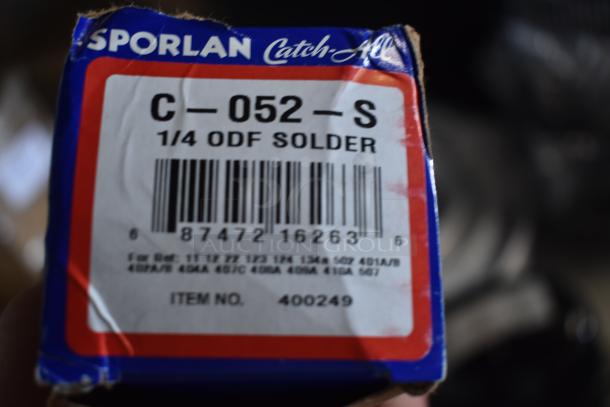 Sporlan Catch-All filter drier box labeled "C-052-S, 1/4 ODF Solder," barcode, item number 400249, suitable for various refrigerants.