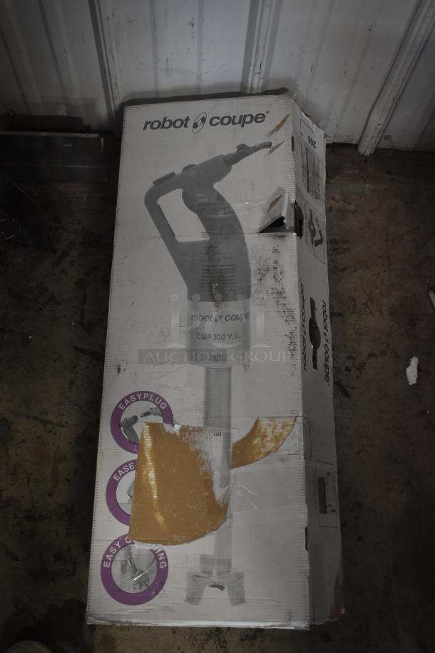 Robot Coupe CMP 300 VV immersion blender in its original packaging. Box shows signs of wear with some tears. Visible "Easy Plug" and "Easy Cleaning" labels.