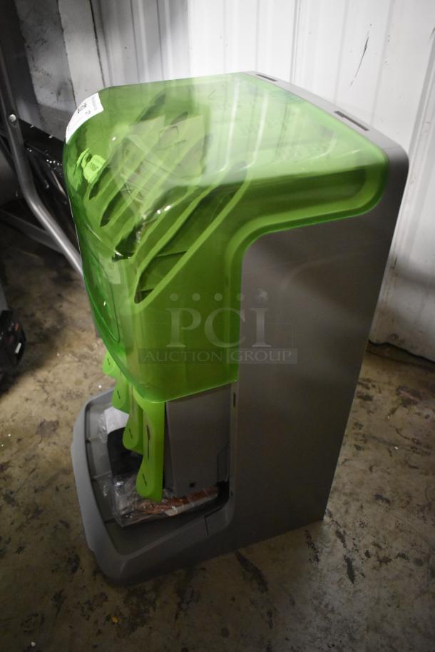 Commercial floor-mounted baby diaper changing station with a green cover, new condition, installation hardware visible.