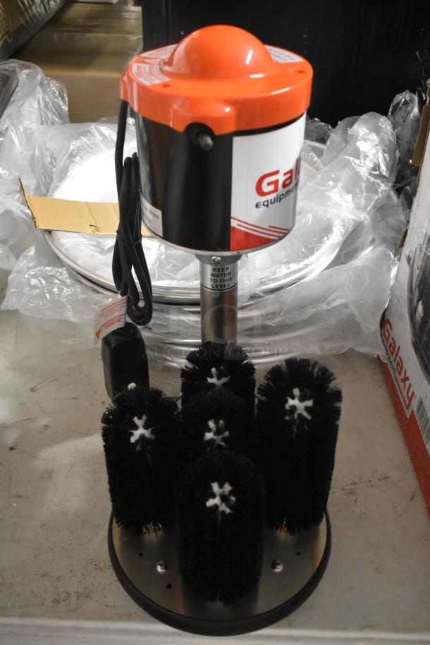 Commercial glass washer with rotating brushes, Galaxy brand, electric-powered, in like-new condition. Tags indicate water level.
