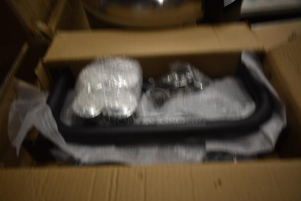 Blurred image of boxed item with wrapped components. Details and condition are unclear.