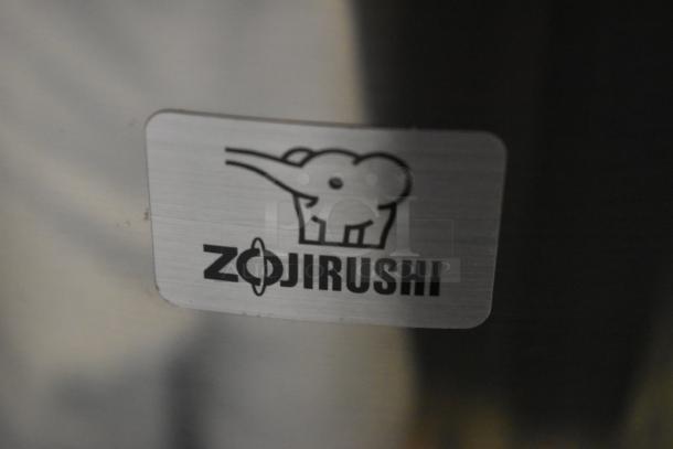 Zojirushi product label featuring an elephant logo on brushed metal.