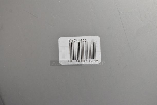 Silver surface with white barcode label displaying "24711422" and barcode number "67108646770."