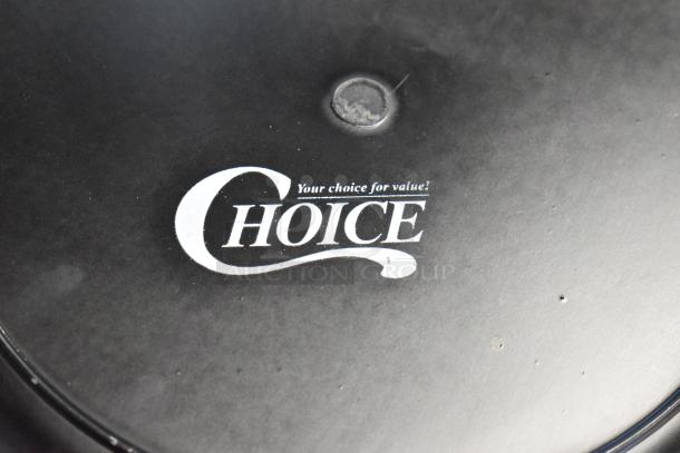 Black circular item with "Your choice for value! CHOICE" text in white. Signs of wear visible, possibly a cover or lid.