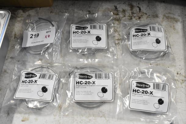 Steril-Sil HC-20-X hinged lids, clear plastic with stainless steel rings for 30-ounce containers, six packs, new condition.