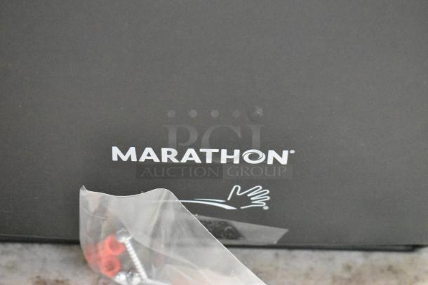 Marathon brand equipment with logo, includes sealed bag of screws and red components. Item appears new.