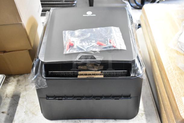 Georgia-Pacific towel dispenser, new condition, with installation kit in sealed plastic bag.