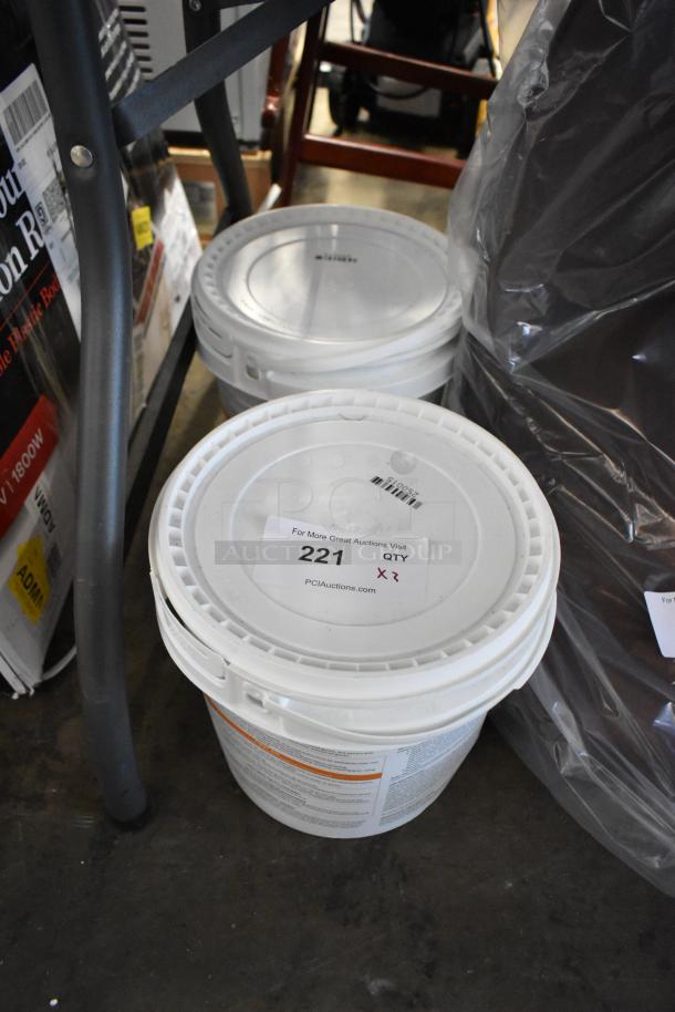 Two white buckets with lids, labeled "221 QTY x2" from PCI Auctions. Instructions and barcode visible on sides.