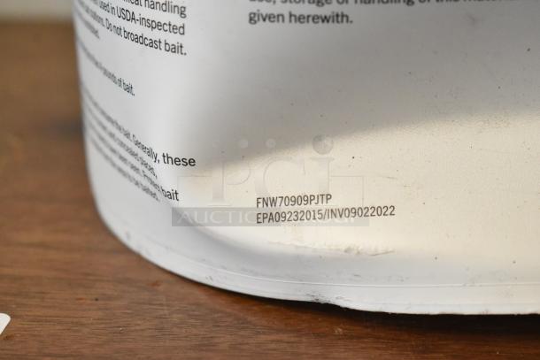 White container with printed text, possibly a product label, and codes: FNW70909PJTP, EPA09232015/INV09022022, indicating manufacturing or batch details.