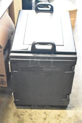 Black insulated Cambro food carrier with front-loading door, sturdy handles, and secure latches. Used condition.
