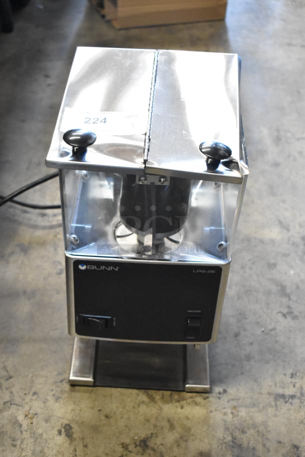 Bunn LPG-2E commercial coffee grinder, stainless steel, used. Features top access panel, power switch, and model label. Tag reads "224".