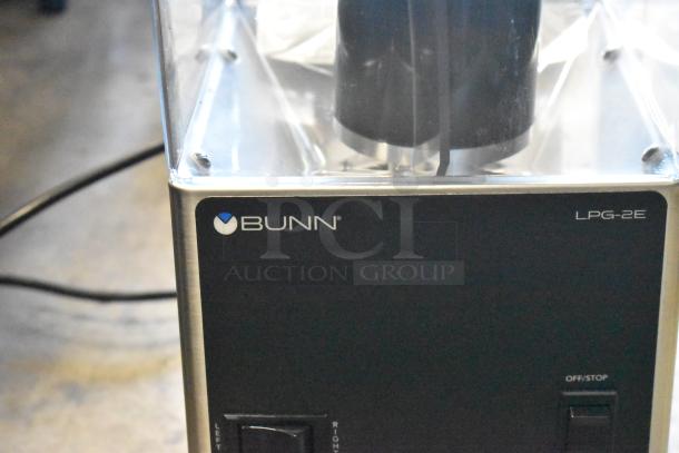 Bunn LPG-2E commercial coffee grinder, black with stainless steel accents; features obvious, good condition, clear hopper.