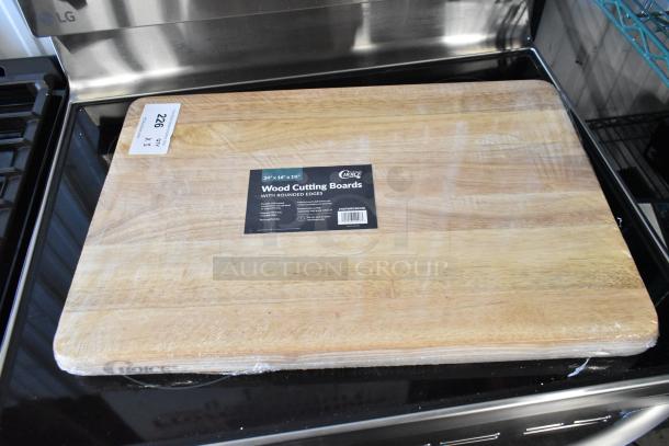 Wood cutting board, 24"x16"x1", new, wrapped in plastic. Label shows "Choice," rounded edges, auction tag "226, Qty x3."