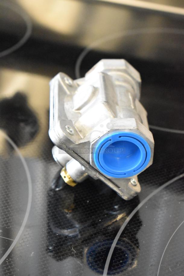 Metal valve with blue plastic cap, possibly a gas or water control component, in excellent condition, no visible markings.