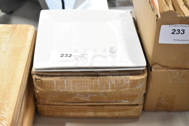 White square dinner plate set of three, stacked on cardboard boxes. Auction tag reads "232 QTY x3".