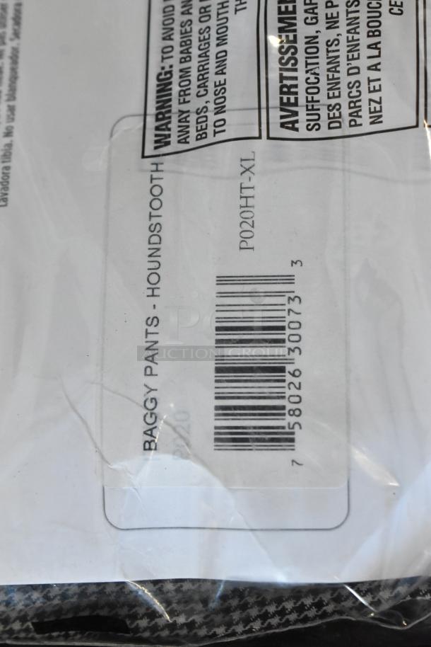 Baggy pants in houndstooth pattern, size XL, model P020HT-XL, with barcode and safety warnings on packaging.