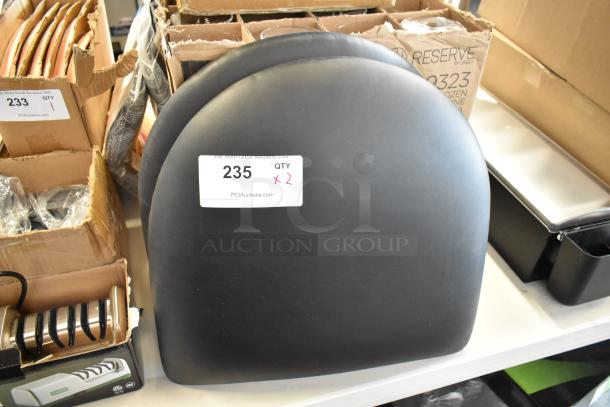 Black padded chair backs, lot of 2, in good condition. Tag: “235 QTY x2 PCIAuctions.com.”