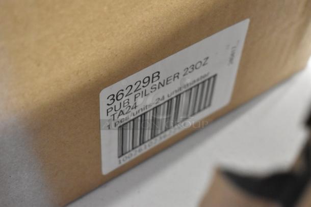 Close-up of a cardboard box with a label reading "36229B PUB PILSNER 23 OZ," indicating 1 piece per unit, 24 units per master box.