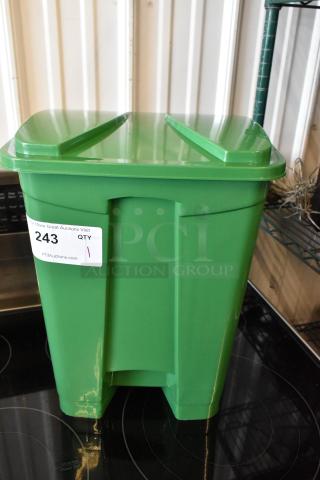 Green plastic container with lid, auction label "243 QTY 1"; in excellent condition for storage use.