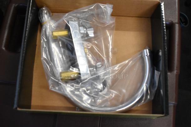 Metal hose and fittings in plastic packaging, new condition, in a cardboard box. Contains brass and chrome components.