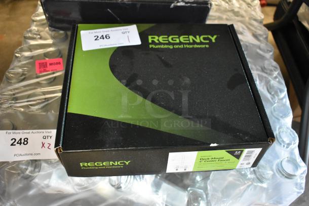 Regency deck-mount 4" center faucet in original packaging. Box marked with auction tags; model includes 12" gooseneck nozzle.