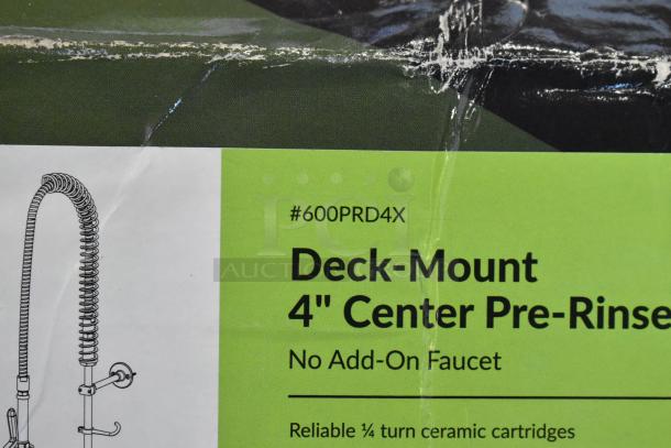 Deck-mount 4" center pre-rinse faucet, model #600PRD4X, with reliable ¼ turn ceramic cartridges. Packaging shows wear.